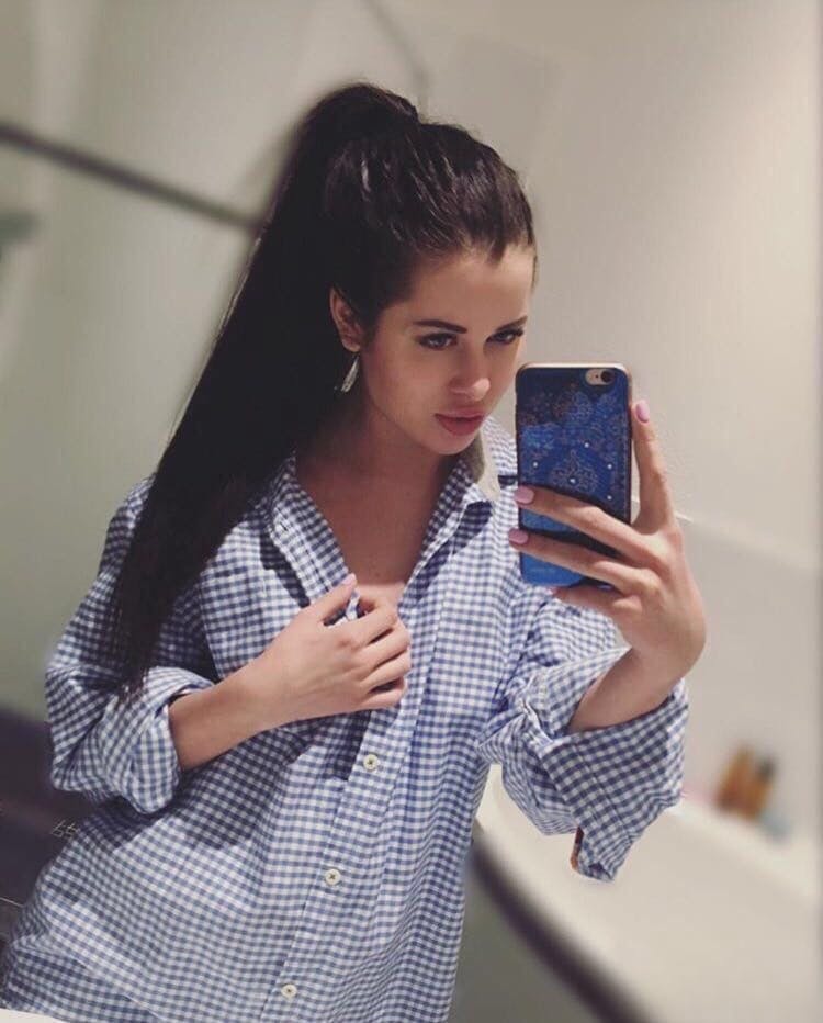 Beautiful dark haired Julia in skimpy outfits taking a sexy selfie