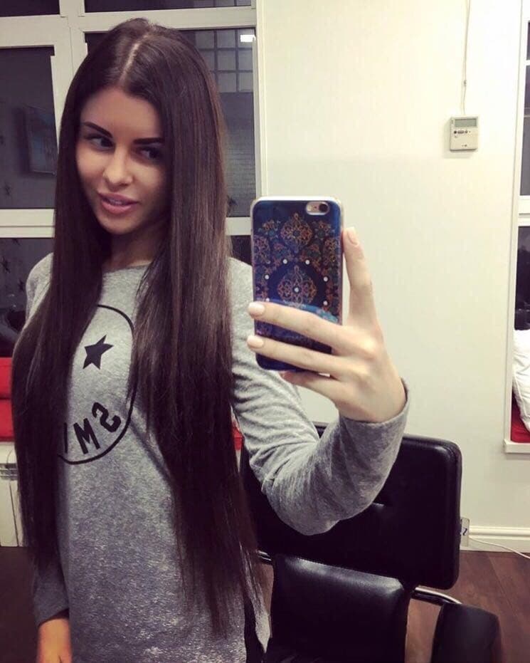 Beautiful dark haired Julia in skimpy outfits taking a sexy selfie