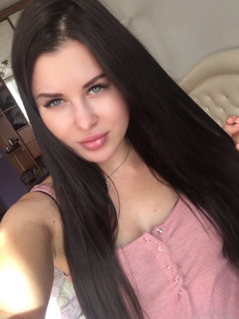 Beautiful dark haired Julia in skimpy outfits taking a sexy selfie