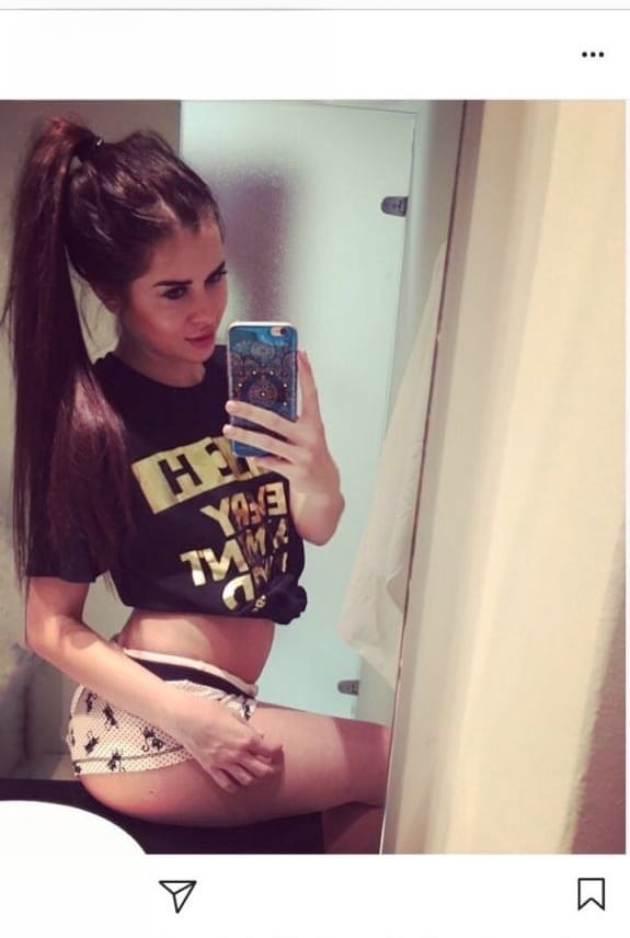 Beautiful dark haired Julia in skimpy outfits taking a sexy selfie