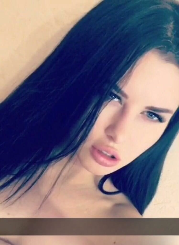 Beautiful dark haired Julia in skimpy outfits taking a sexy selfie