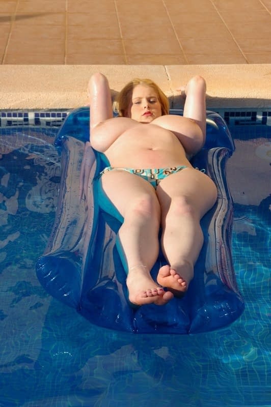 Fat first timer Ashley Sage Ellison goes topless on an air mattress