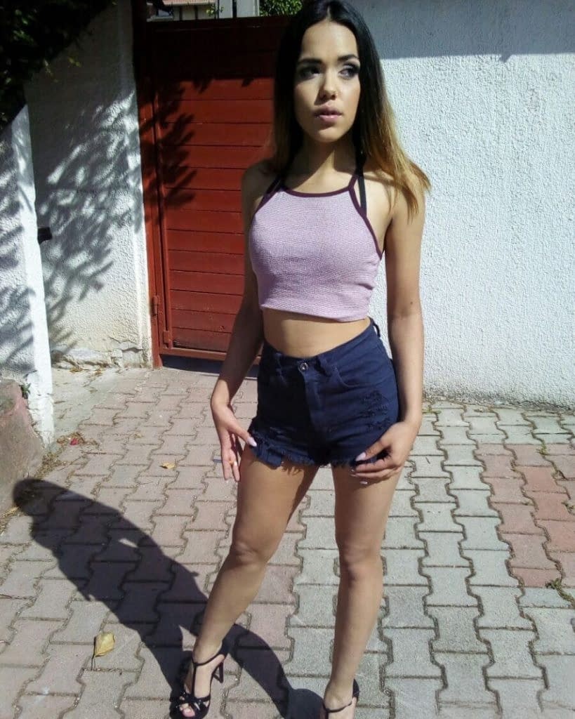 Sweet young brunette slut Esperanza poses topless for hard nipples selfie