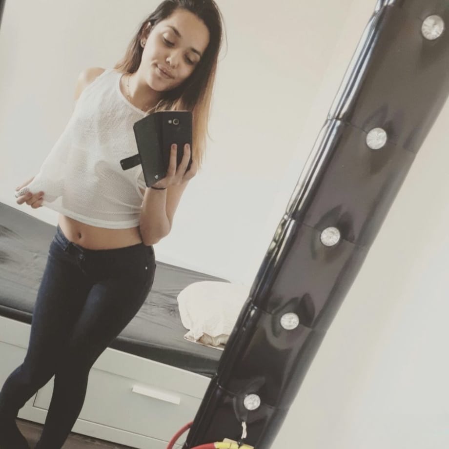 Sweet young brunette slut Esperanza poses topless for hard nipples selfie
