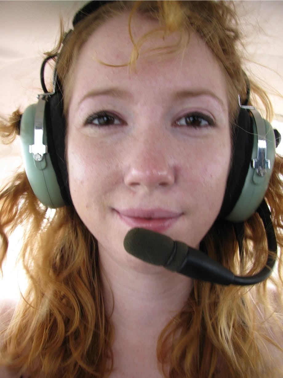 Natural redhead Nicki Blue gets totally naked aboard a small engine aircraft