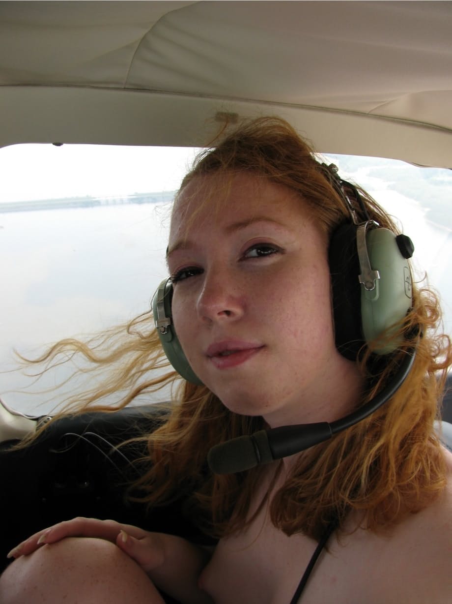 Natural redhead Nicki Blue gets totally naked aboard a small engine aircraft