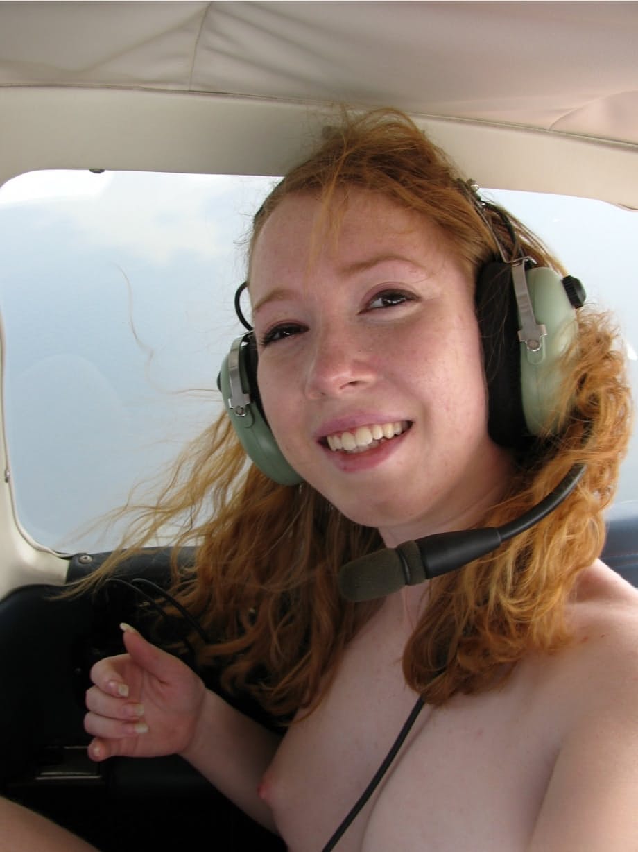 Natural redhead Nicki Blue gets totally naked aboard a small engine aircraft