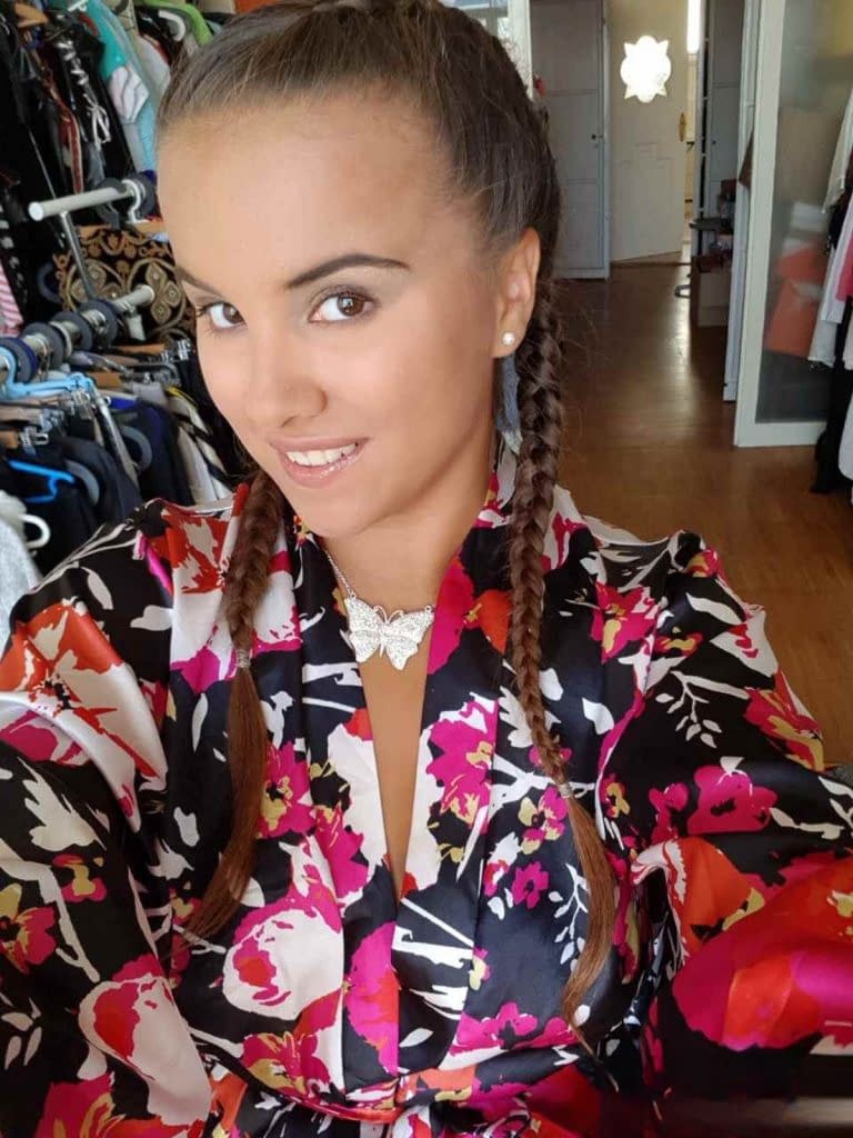 Young looking Latina girl Olivia hides her huge tits while taking selfies