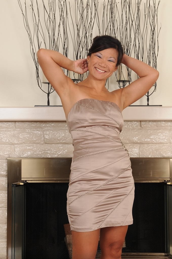 Mature Asian Samantha W exposes hard nipples on small tits & a bald snatch