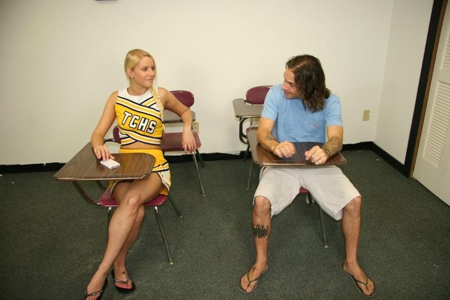 Blonde cheerleader Vanessa Cage unveils her perky tits before giving a handjob