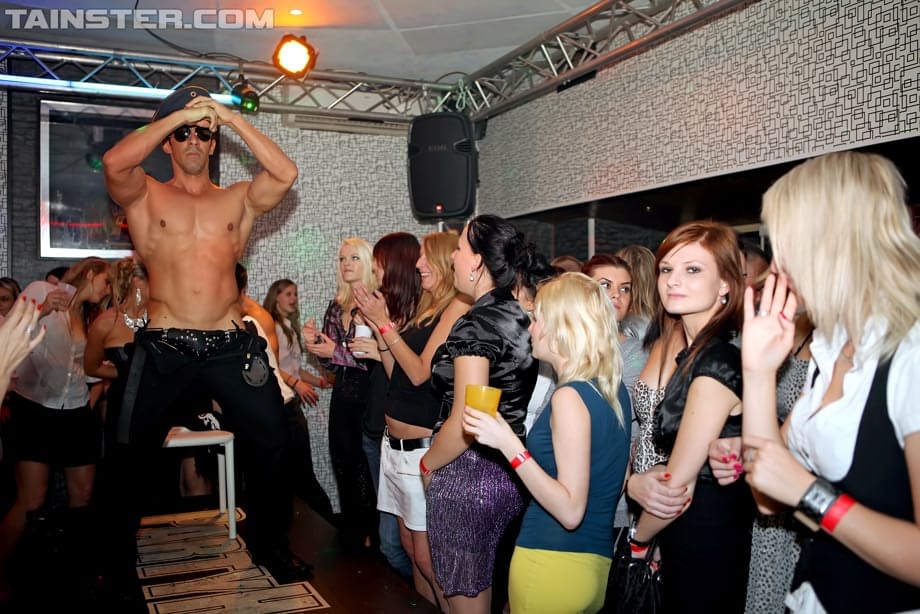 Clothed females get drunk and fuck male strippers inside a nightclub