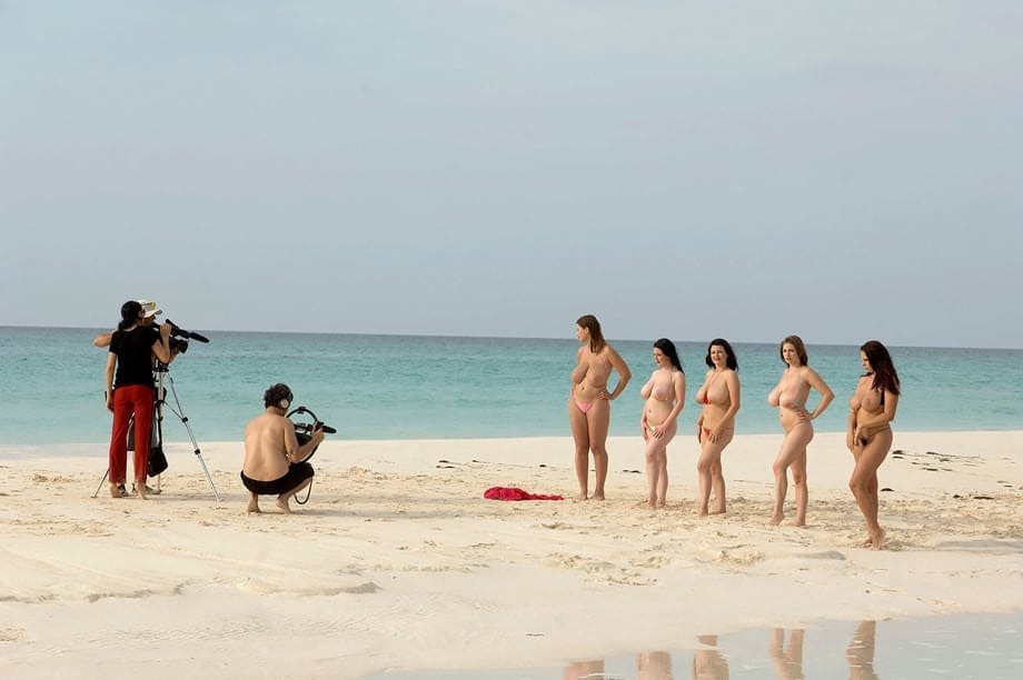 Hot MILF women stripping bikinis to bare big tits on the beach