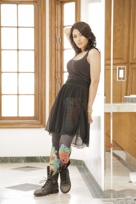 Punk girl Raven Rockette stands naked in well used boots after a striptease