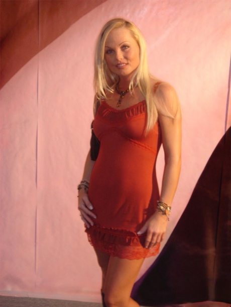 Sexy pornstar MILF Silvia Saint posing fully clothed in jeans and boots