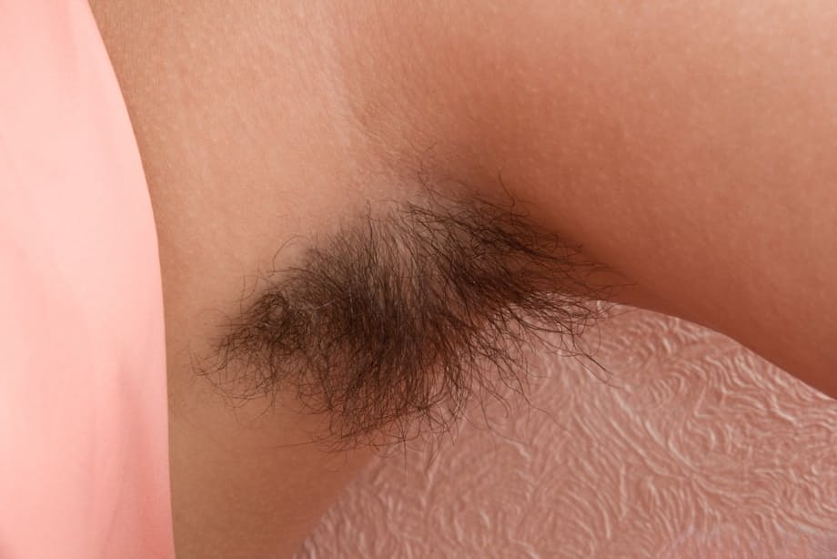 Petite teen Baby Lizza proudly exhibits hairy armpits and beaver