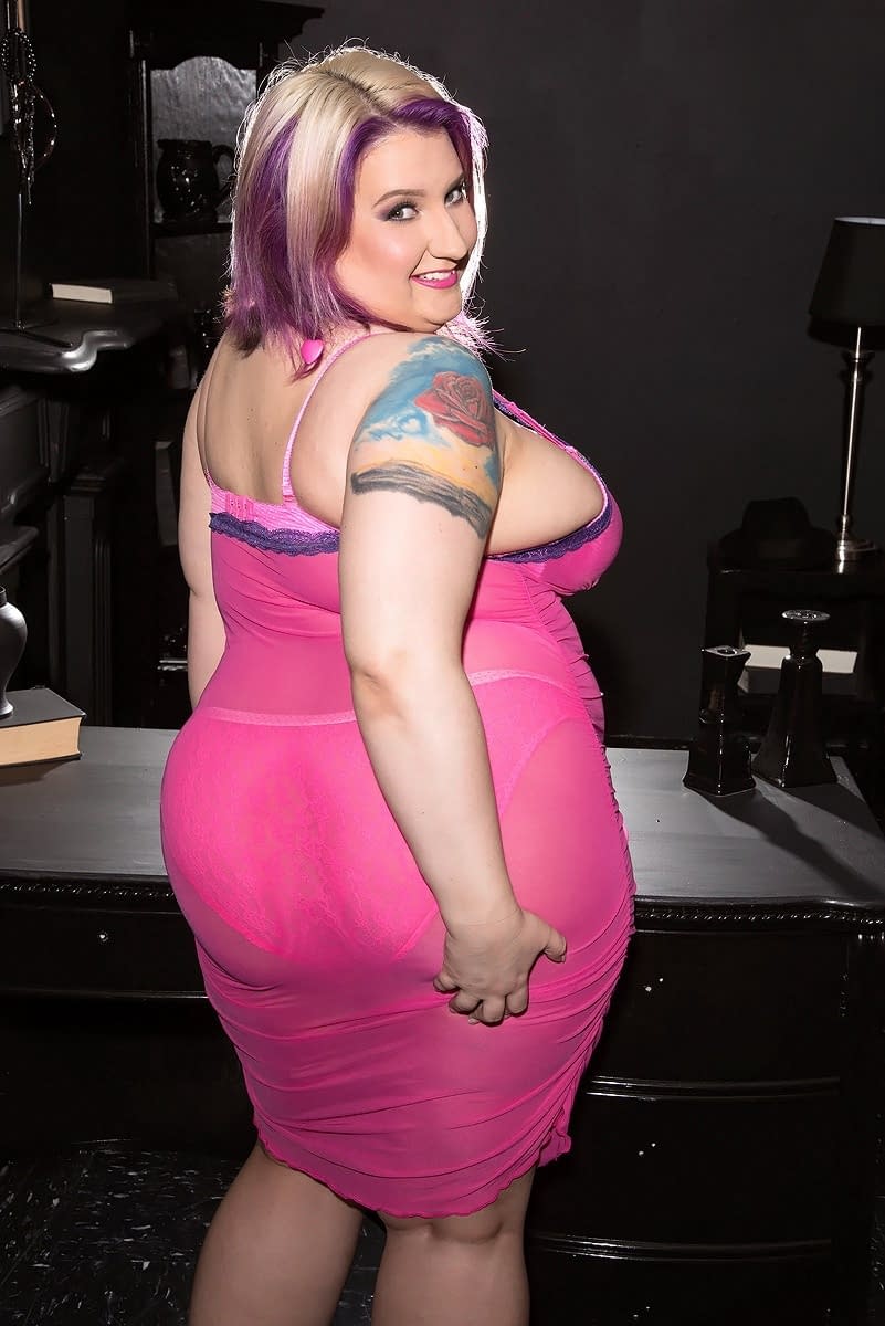 Obese female Porsche Dali releases her saggy boobs from sheer attire and bra