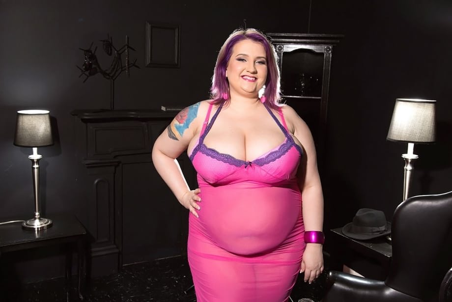 Obese female Porsche Dali releases her saggy boobs from sheer attire and bra