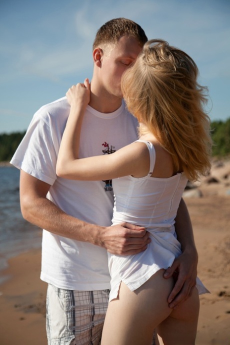 Young girl with naturally blonde hair gets banged on beach by the ocean