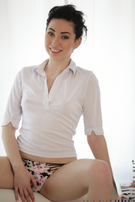 Short haired coed Aria Alexander undresses for an afternoon of masturbation