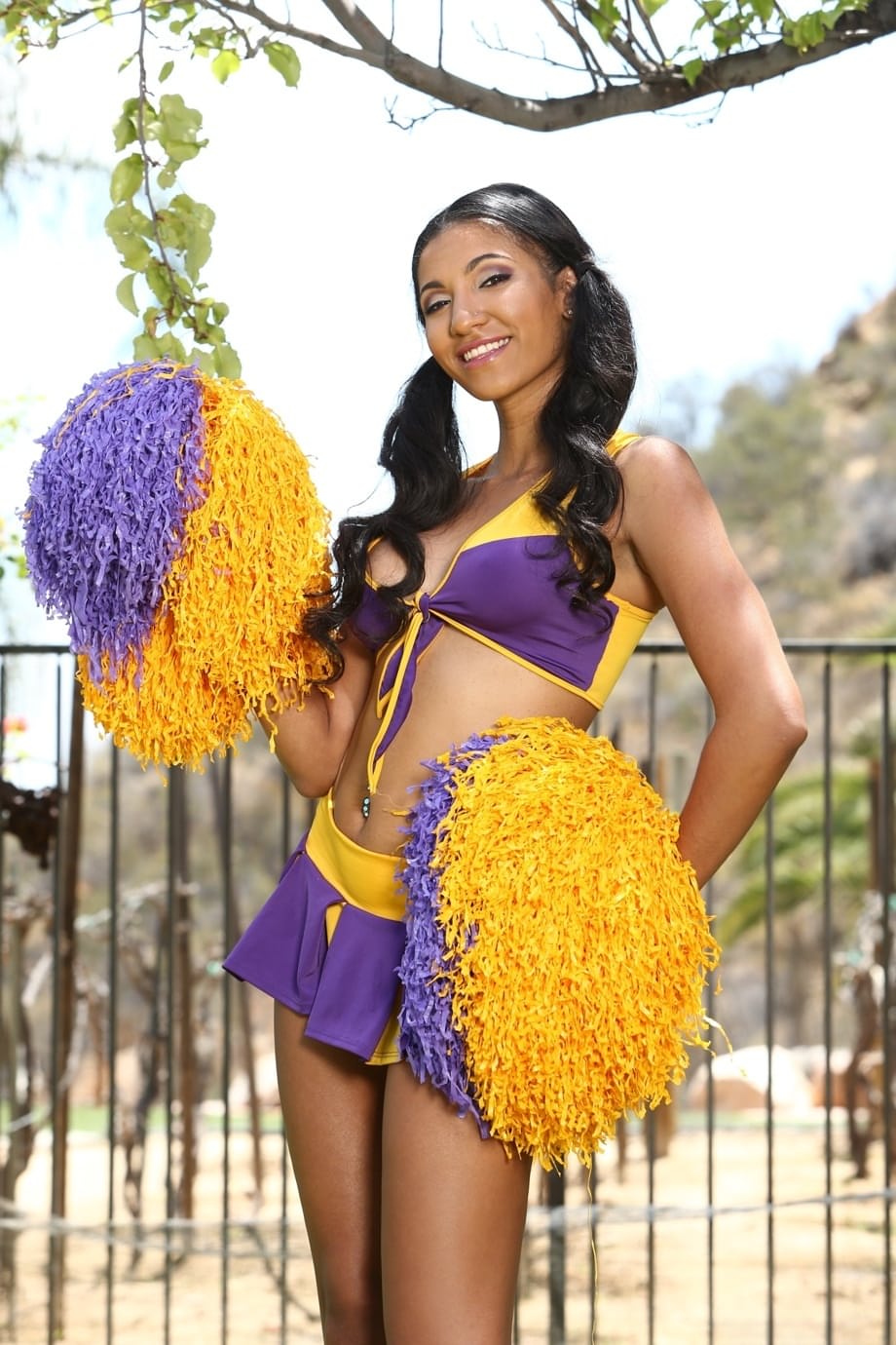 Latina cheerleader Sadie Santana giving a glimpse of her pussy in backyard