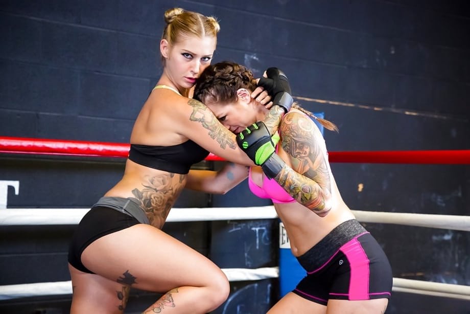 Female kick boxers settle their bout with lesbian sex in boxing ring