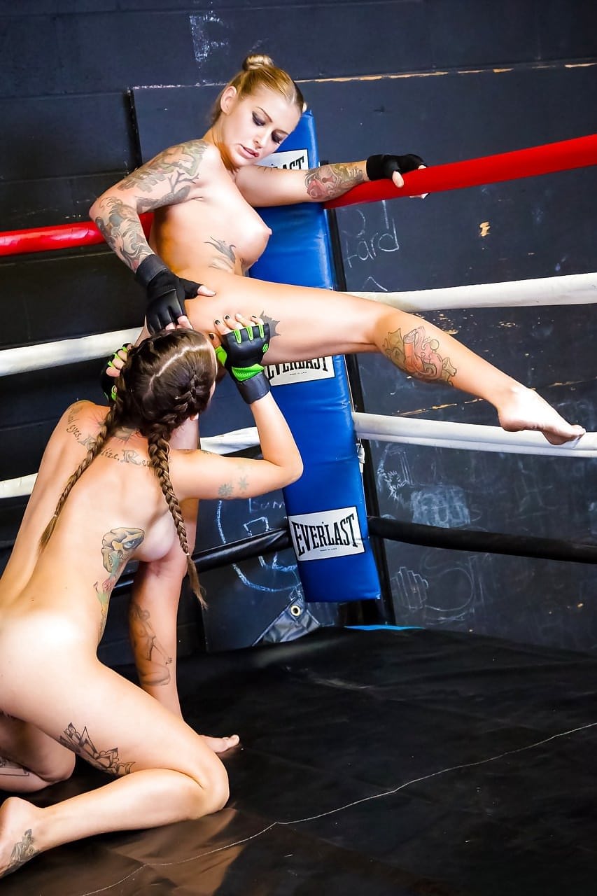 Female kick boxers settle their bout with lesbian sex in boxing ring