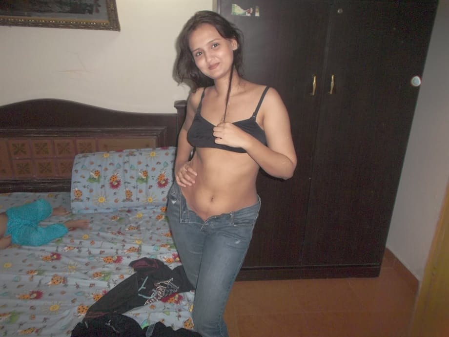 Hot Indian model in tight jeans posing seductively in sexy lace bra