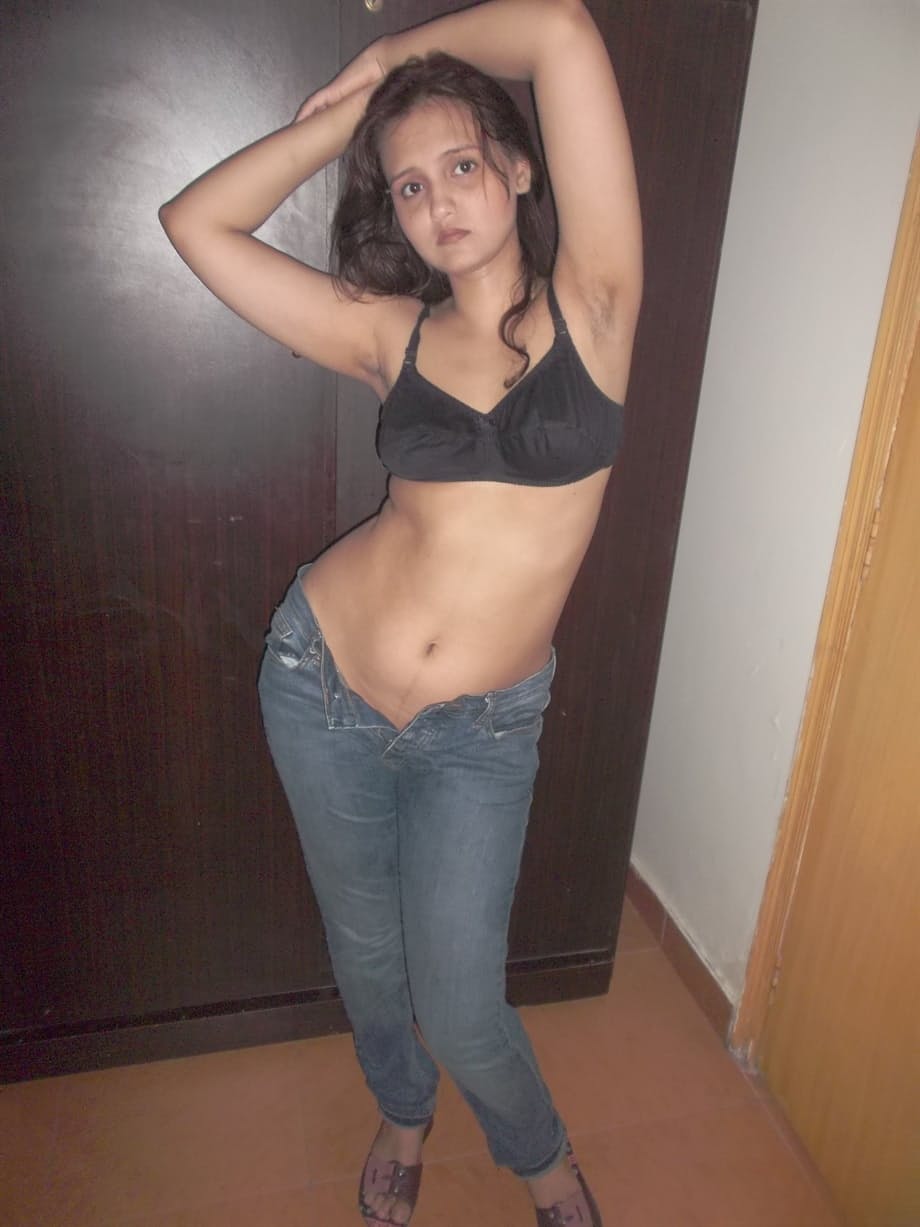 Hot Indian model in tight jeans posing seductively in sexy lace bra