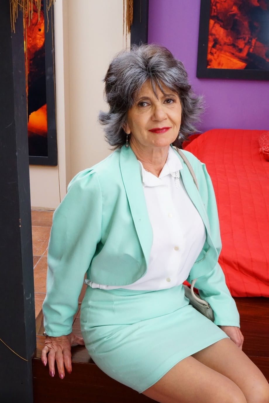 Naughty grandmother with great legs strips down to her bra and underwear