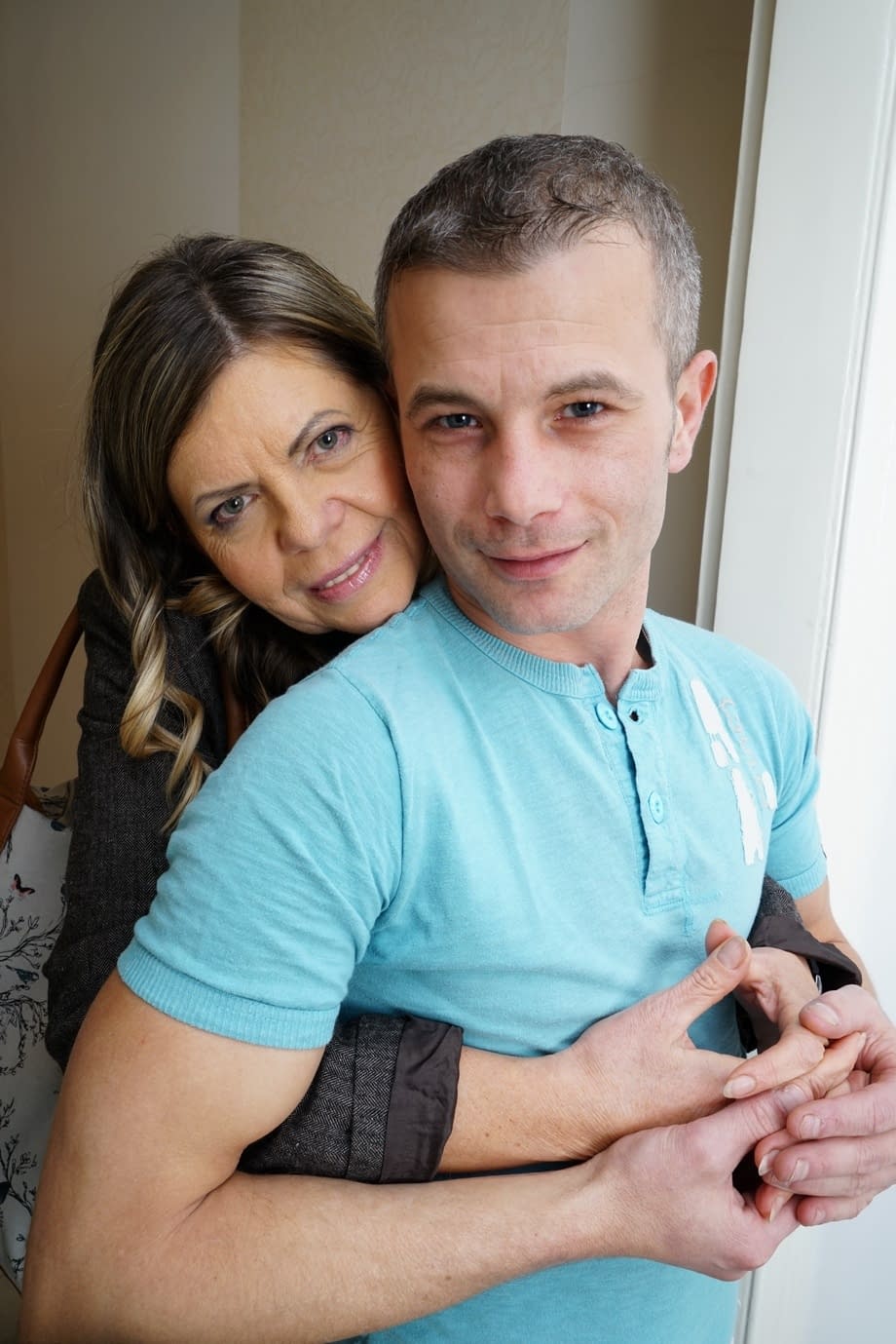 Mature couple undress as they fan the flames before fucking on a bed
