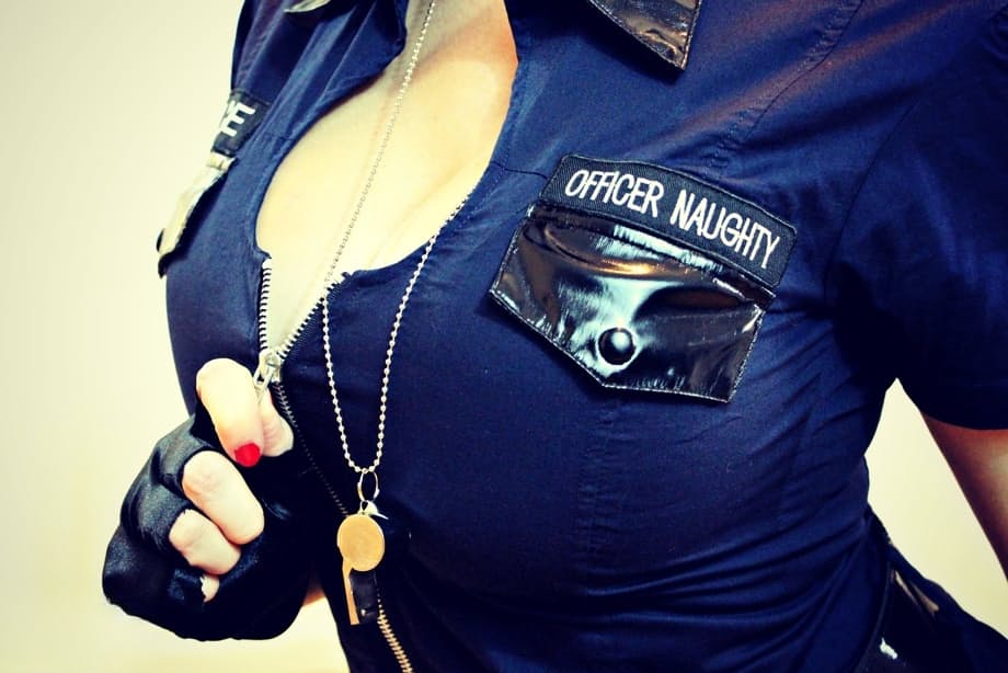Female police officer Kayla Kiss uncovers her firm boobs as she strips to hose