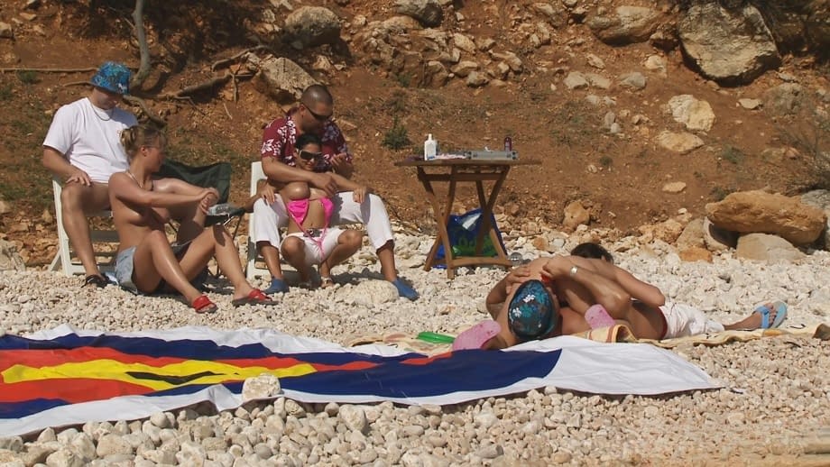 A day at a nude beach turns into a day of group sex fucking under the hot sun