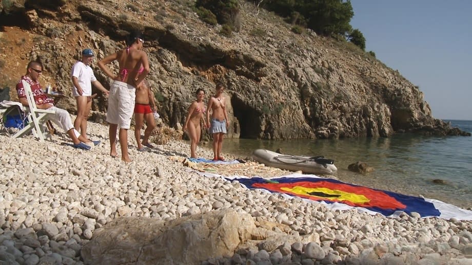 A day at a nude beach turns into a day of group sex fucking under the hot sun