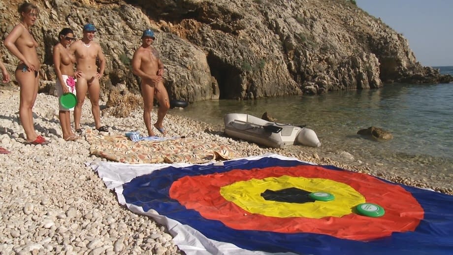 A day at a nude beach turns into a day of group sex fucking under the hot sun