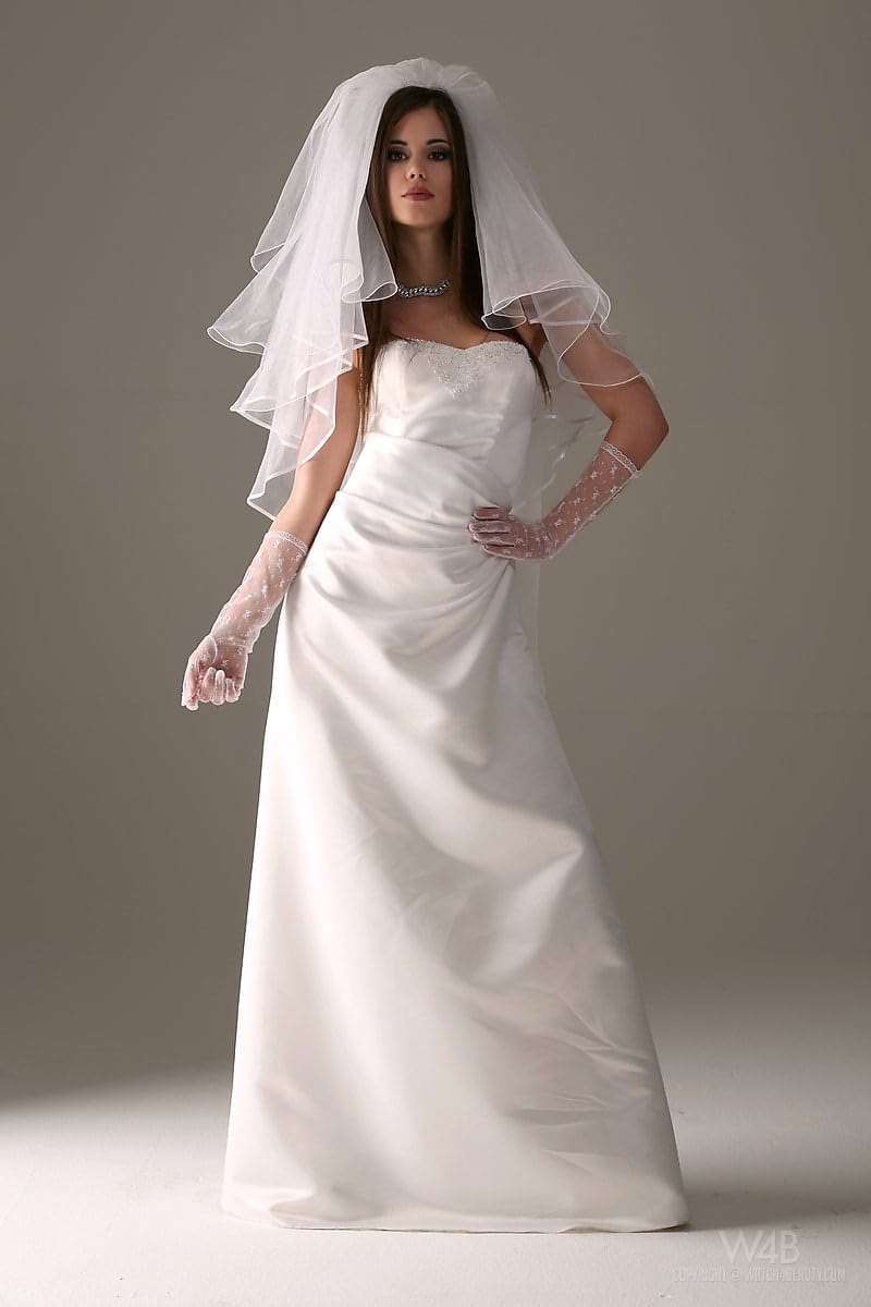 Glamour model Little Caprice strips off her wedding dress