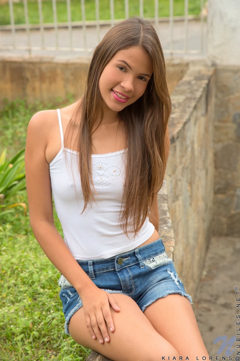 Sweet teen Kiara Lorens sheds shorts & shirt to spread pussy lips outdoors
