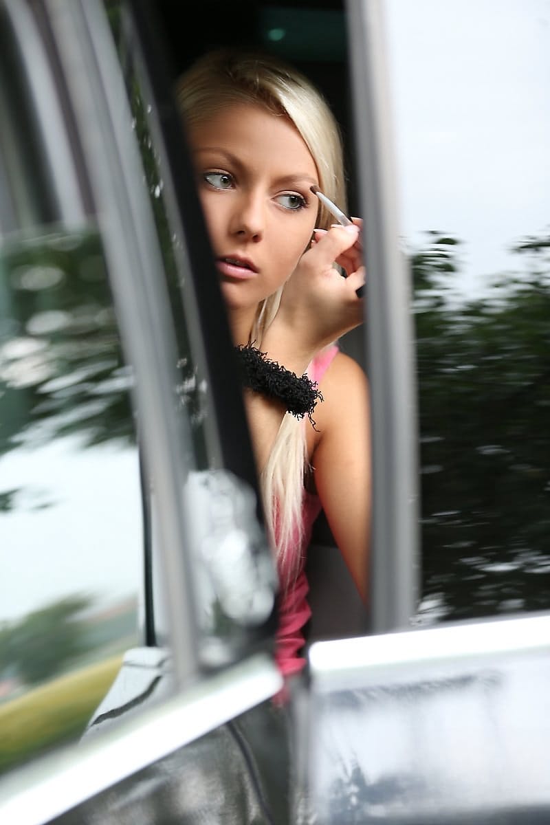 Beautiful blonde teen Grace puts out her smoke and models naked beside road