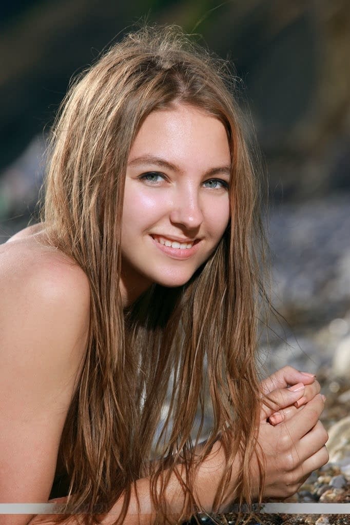 Teen babe Izabel A sporting nice camel toe outdoors on beach in bikini
