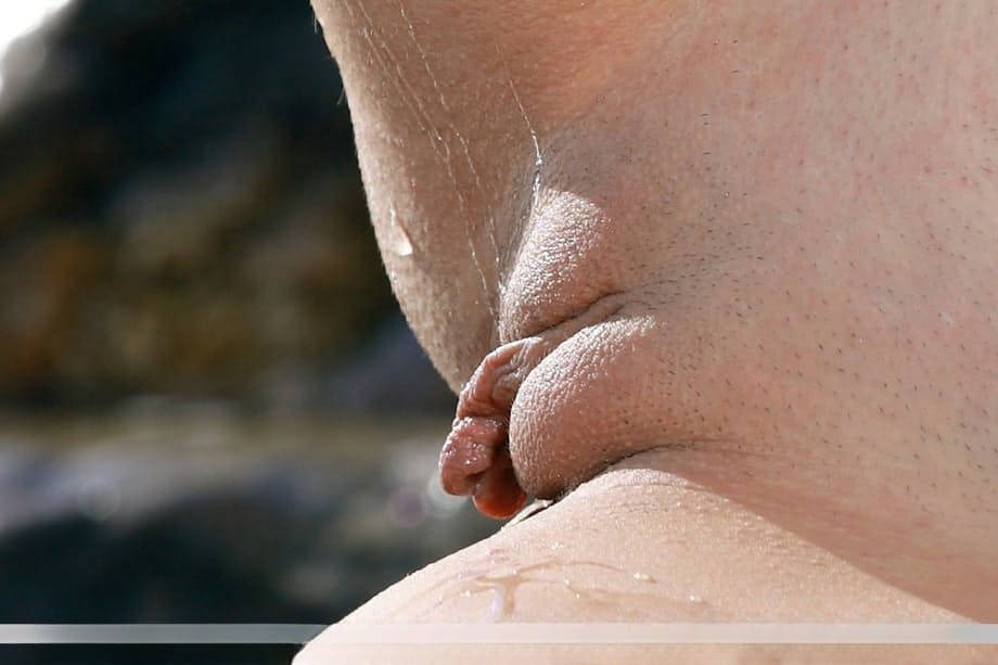 Teen babe Izabel A sporting nice camel toe outdoors on beach in bikini
