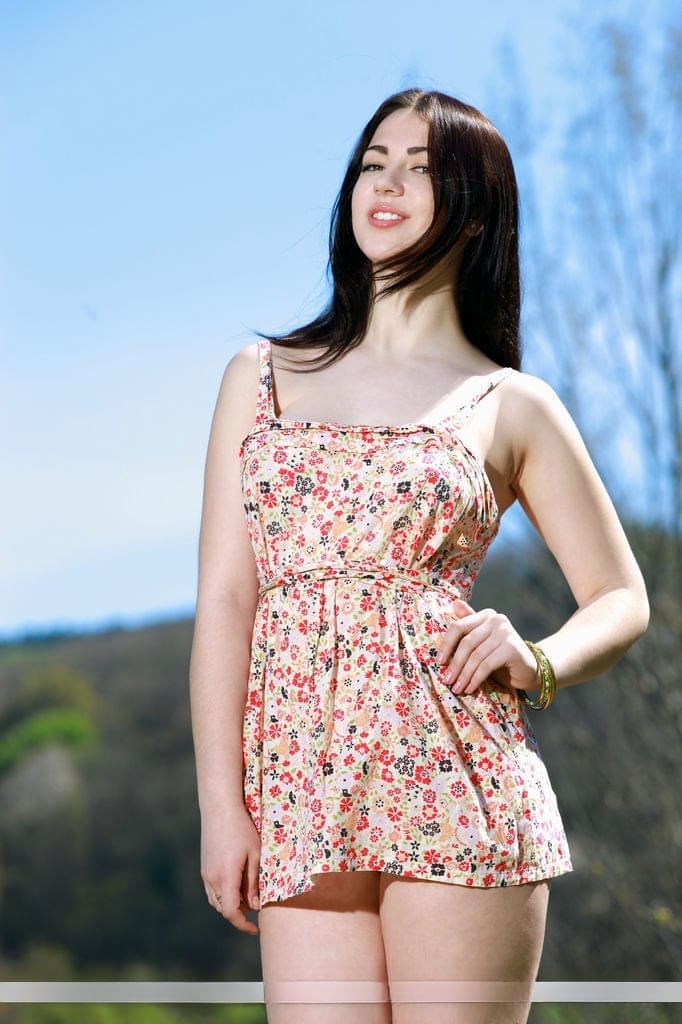 Brunette babe shedding summer dress outdoors for teen glamour photos
