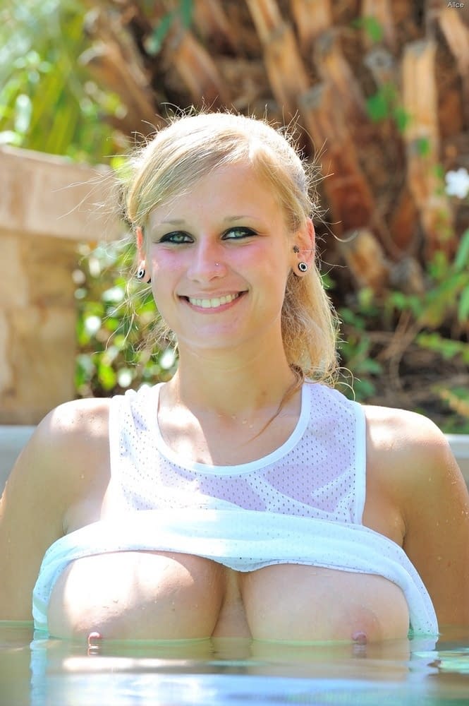 Big titted amateur blonde spreads her sweet pussy lips by the pool
