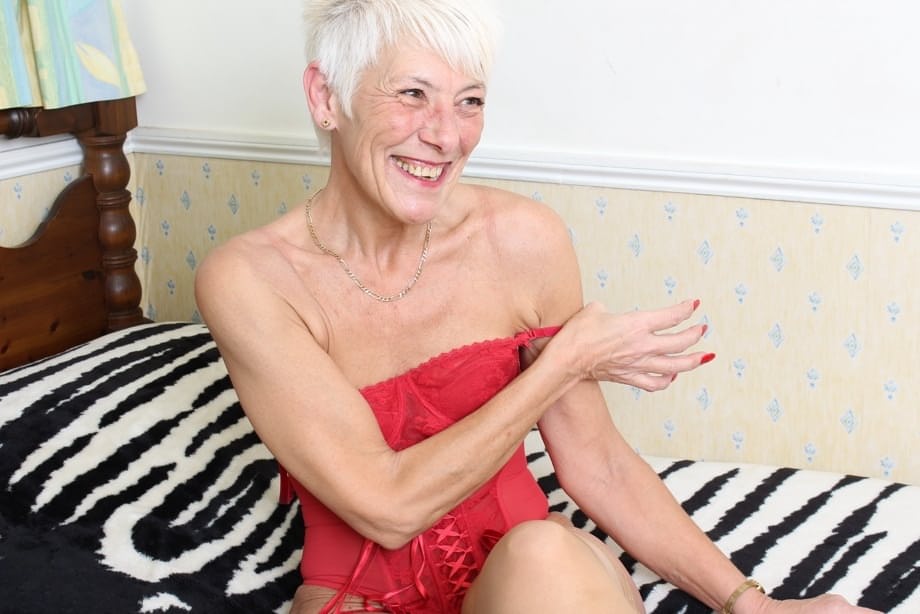 Over 70 Bristish granny takes off her clothes and lingerie striptease style