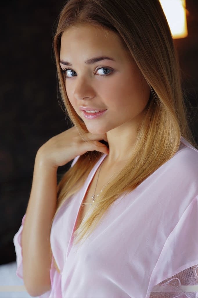 Blonde babe Colleen A spreading smooth teen pussy after undressing