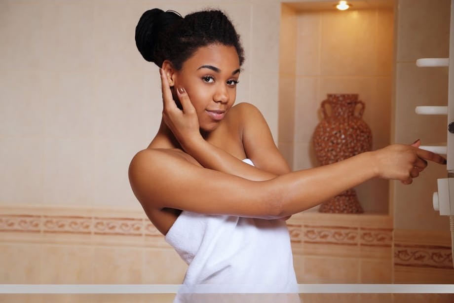 Young ebony girl Gana wets her shaved vagina after getting in bathtub