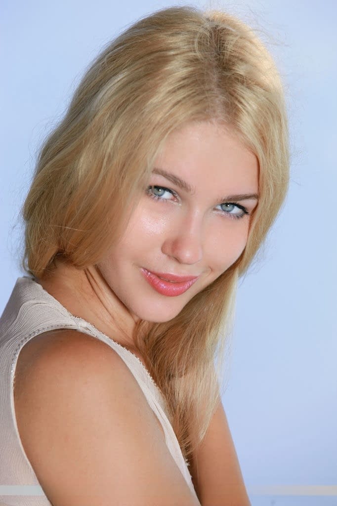 Lovely Euro chick Genevieve Gandi likes showing off her shaved pussy