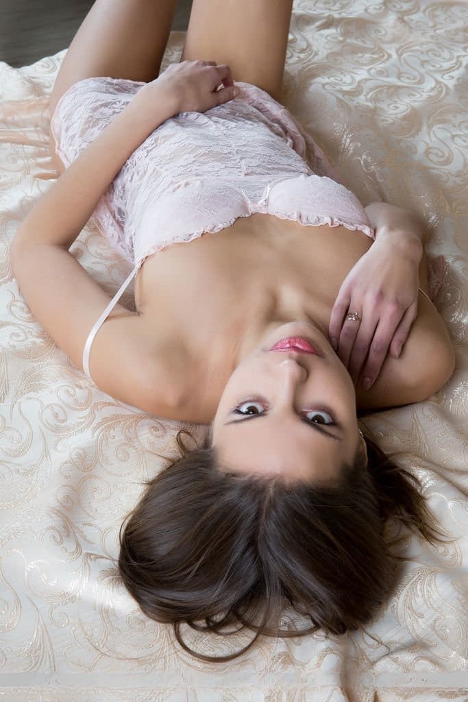 European glamour model Sandra Lauver posing with legs wide open behind head