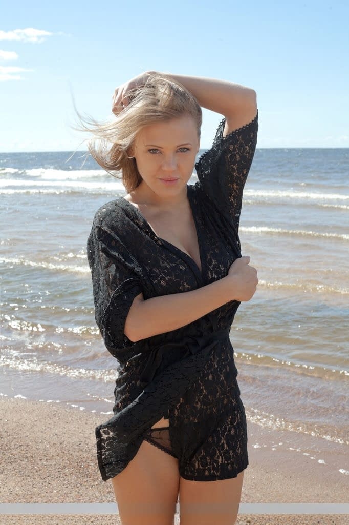 Sensual blonde babe Viola unveils her big tatas on the beach