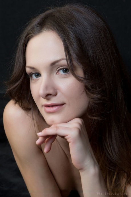 Barefoot Euro girl Zhanet A exposing naked pussy underneath tan panties