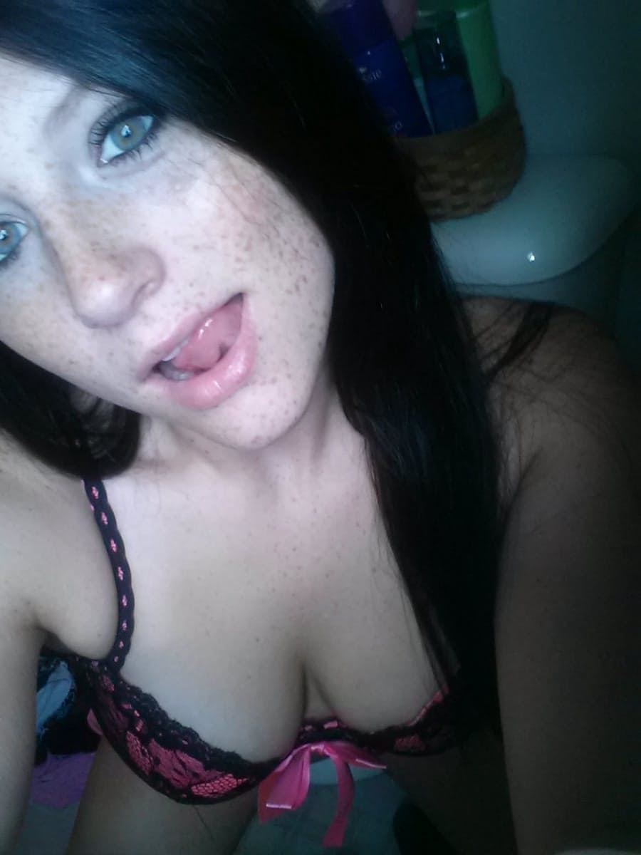 Self shot of amateur Freckles in stockings & sexy lingerie showing tongue