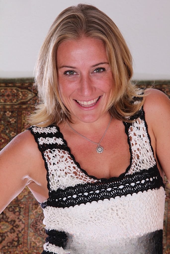 Mature blonde Sky squats in heels after a slow striptease on a landing